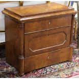 Austrian chest circa 1850, having a casket form top, above the three drawer case, flanked with