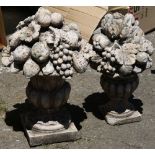 (lot of 2) Continental cast garden sculptures depicting a bountiful fruit harvest, largest 24"h