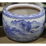 Japanese ceramic hibachi, blue-and-white with landscape in molded surface, 18"h x 11.75"dia