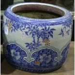 Japanese ceramic hibachi, with various flowers in blue-and-white accented by colors, 13"h x 16"dia