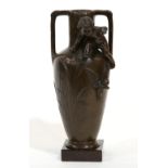 Patinated bronze amphora vessel executed in the Art Nouveau taste circa 1910, the vessel flanked