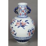 Chinese underglaze blue and red porcelain vase, the cylindrical neck flanked by braided handles, the