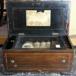 Swiss cylinder music box, with a drum, castagnette, and bells, having a marquetry decorated lid,