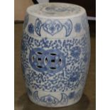 Pair of Chinese underglaze blue porcelain stools, decorated with floral tendril surrounding linked