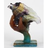 Pate de verre art glass sculpture, executed in multiple colors, depicting a hand clutching a conch