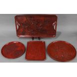 (lot of 4) Japanese lacquered trays with various carvings: all in vermilion color, first, a circular