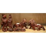 (lot of 5) One shelf of Chinese wood carvings, consisting of two lions, a qilin, and two figures,