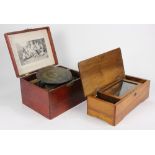 (lot of 2) Music box group, 19th century, consisting of a German cylinder music box, having a wind