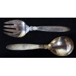 (Lot of 2) Pair of Georg Jensen sterling serving utensils in the "Cactus" pattern, 9.19 troy oz