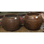 Pair of Chinese brown glazed ceramic fish bowls, molded with lotus scrolls and flanked by lion