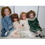 (lot of 4) German porcelain bisque head doll group, including a Simon and Halbig example, having