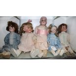 (lot of 5) Continental porcelain bisque head doll group, each with glass eyes open mouths with