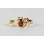 Ruby, diamond and 14k yellow gold ring featuring (1) oval-cut ruby, weighing approximately 0.45 ct.,