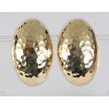 Pair of 14k yellow gold earrings the hammered textured oval button style earrings, measuring