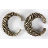 (Lot of 2) Silver bracelets comprised of one wire twist dome cuff, measuring approximately 30 mm