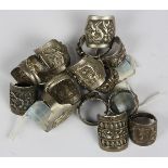 (Lot of 14) Silver rings comprised of (6) silver rings, depicting human figures; together with (8)