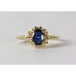 Sapphire, diamond and 18k yellow gold ring centering (1) oval-cut sapphire, weighing approximately