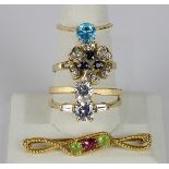 (Lot of 5) Cubic zirconia, peridot, tourmaline, sapphire, diamond, and yellow gold jewelry comprised