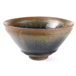 Chinese Jian type ceramic bowl, with a dark glaze with russet colored oil spots, recessed base