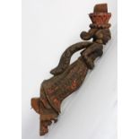 African polychrome decorated carved wood ships prow, 19th century, depicting a figure of a woman (