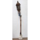 Venetian polychrome decorated gondola pole, the copper lantern having glass paneled sides, above the