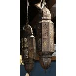 Pair of Moorish hall lanterns, each having a reticulated body with scroll and floral accents, 42"h x