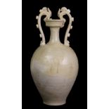 Chinese Tang straw glazed ceramic amphora, the pair of handles in the form of dragons bitting onto