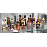 (lot of 19) Russian lacquered figural ornaments, depicting nuns, priests, an accoridan player, etc.,