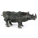 Chinese archaistic bronze rhino, cast with taotie motifs and with a hinged lid on its back, 14.75"h