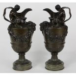 (lot of 2) Continental style patinated bronze ewers, executed in the Neoclassical taste, the mouth