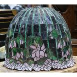 Large tiffany style leaded glass lamp shade, having a dome form with floral decoration, 15.5"h