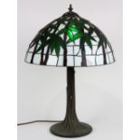 Tiffany style leaded glass table lamp, having a domed shade with bamboo decoration on a white