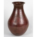 Dirk Van Erp style hammered copper vase, having a tapered form with a rolled rim, the body with a