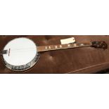 Vintage Washburn banjo, having inlaid mother of pearl detail, 38.5"h