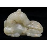 Chinese hardstone carving, the handling piece in the form of a horse licking its hind hoof, 2.25"w