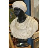 Continental figural carved wood and composite bust, depicting a Blackamoor, and rising on a circular