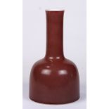 Chinese ox blood glazed porcelain vase, the yaolingzun with a long neck above a dome shaped body,