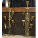 Pair of Hollywood Regency style brass sconces, each having five lights with cone shades, having