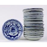 (lot of 18) Chinese underglazed blue porcelain dishes, each centered by a crane, encircled by a
