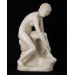 French marble figural sculpture late 19th century, depicting a seated nude bather in a