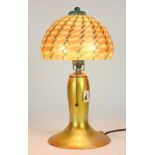 Lundberg Studios iridescent art glass table lamp, the dome shade having pulled accents in teal to