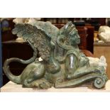 Classical style cast bronze sphinx, depicted gazing outward and rising on a scrolled base, 18"h