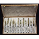 (lot of 12) German .800 dessert flatware, consisting of (6) four prong forks, the prongs having gilt