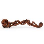Chinese wooden ruyi scepter, in the form of a flowering branch, accented by a bird, 11"w