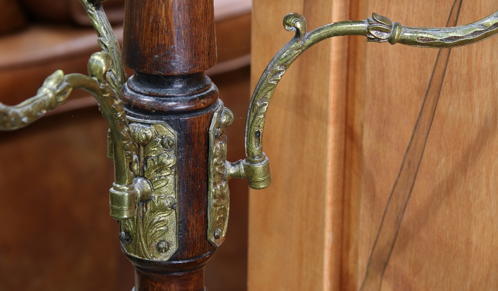 English coat rack, the turned wood standard with applied brass hooks, and rising on a cast iron - Image 2 of 2