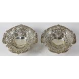 Pair of Tiffany & Co. sterling silver salvers , each having an open shell form with foliate