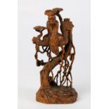 Chinese wood figural carving, featuring Bodhidharma seated on a tree, 5.5"h