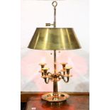 Louis XVI style gilt bouillotte lamp, having four scrolled arms, rising on a circular molded base,