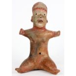 An authentic Pre-Columbian Olmec baby, seated with short fat legs spread like a baby, short thick