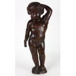 Italian Santo Nino, the carved wood statue depicting a posturing child with draped fabric adornment,